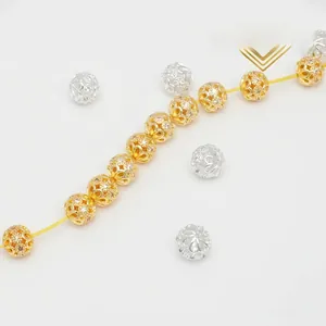Macro view of gold and silver hollow carved beads with micro-set zircon for DIY jewelry