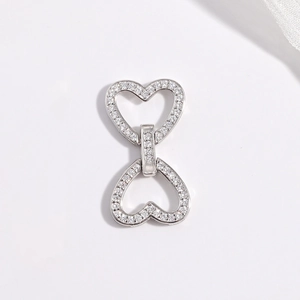 Close-up of S925 sterling silver heart-shaped connector with pavé white zircon stones