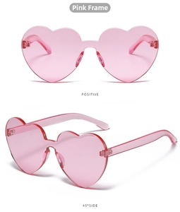 Detailed front and side view of pink rimless heart sunglasses in a clear resin finish