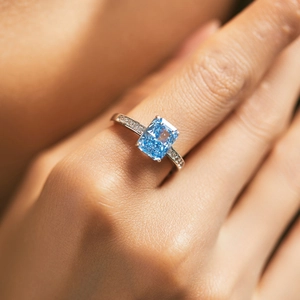 S925 sterling silver ring with rectangular ice-cut blue zircon on a model's finger
