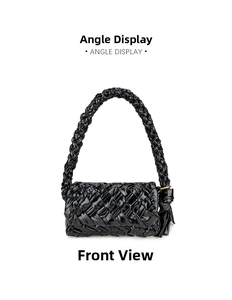 Detail of black glossy oil wax leather woven crossbody bag with fringe knotted handles