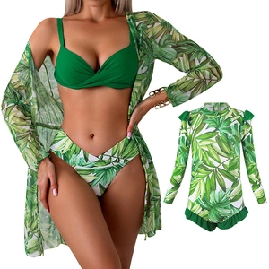 Three-piece family matching bikini set with green palm leaf print cover-up and child swimsuit