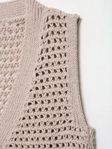 Close-up of khaki crochet hollow knit vest showing intricate cotton stitch details