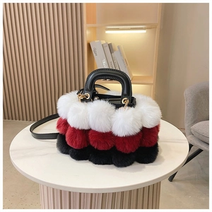 Close-up of three-color plush faux fur texture with elegant golden metal hardware accents