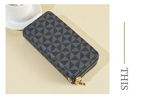 Detailed close-up of double-zipper PU wallet with gray geometric triangle pattern and gold hardware
