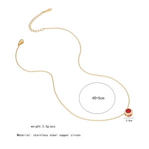 Detail view of 0.8cm red zircon pendant on 40+5cm golden stainless steel chain