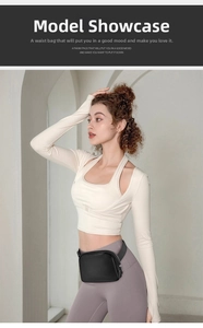 Adjustable black nylon waist bag with silver zippers shown in a minimalist studio setting