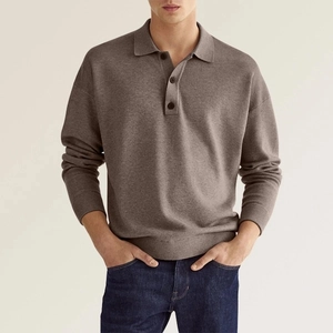 Detail of three-button V-neck placket on men's long-sleeve tan knit polo shirt