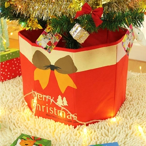 Red non-woven Christmas tree base cover with yellow bow and Merry Christmas pattern