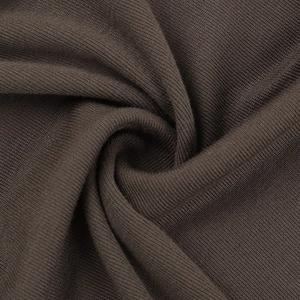 Detailed close-up of dark brown ribbed knit fabric showing fine texture and soft flexibility