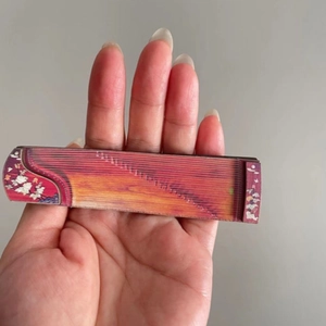 Miniature wooden Guzheng musical instrument fridge magnet with detailed red finish