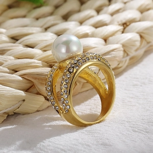 Golden plated titanium ring with large white pearl and side micro-pave crystals