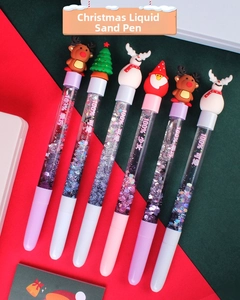 Close-up of Christmas quicksand pens featuring 3D Santa, Reindeer and Snowman toppers