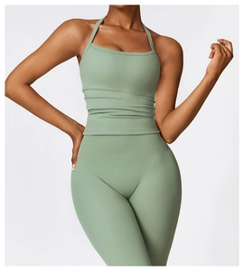 Sage green padded yoga set featuring a halter neck sports bra and high waisted leggings