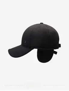 Detailed side view of winter wool baseball cap with earflaps and silver metal shield emblem