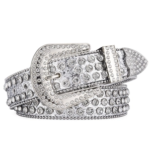 Western style rhinestone studded belt with horseshoe buckle and metal tip on white background