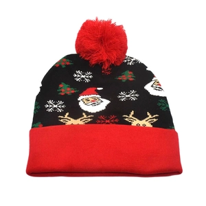 Detailed view of the Christmas knit hat featuring Santa Claus, elk, and snowflake patterns