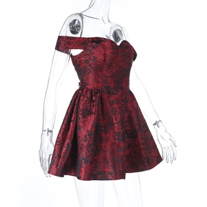 Detail of burgundy floral jacquard fabric on an off-shoulder mini dress with flared hem