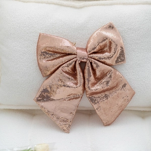 Sparkly rose gold sequin bow decoration for Christmas tree and festive floral crafts