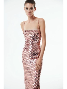 Close-up of rose gold scale sequins on backless party dress with slim shoulder straps