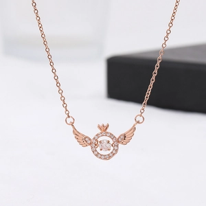 Rose gold angel wing necklace with a dancing zircon pendant on a white background