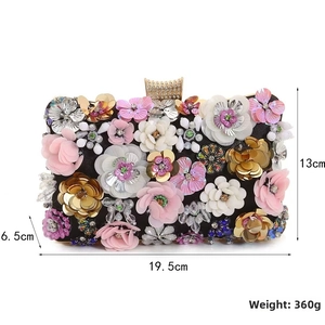 Detailed view of floral evening clutch dimensions 19.5x13x6.5cm with 3D petal sequins