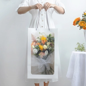 White paper gift bag with large PVC window and elegant ribbon handle for flower bouquets