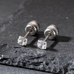 Detailed macro view of 3mm round clear cubic zirconia stainless steel stud earrings