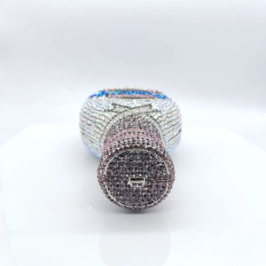 Close-up of the champagne bottle rhinestone evening bag showing the clasp and crystal detail