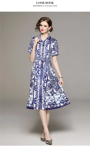 Detail of blue floral porcelain print dress with button-up collar and waist belt