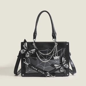 Gothic black ita bag with white spider web print and butterfly charms and chain detail
