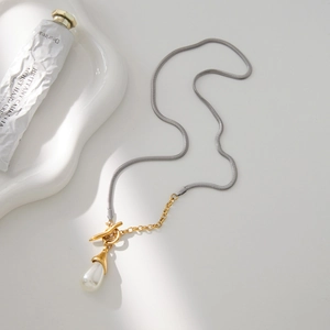 Two-tone snake and link chain necklace with OT buckle and teardrop pearl pendant