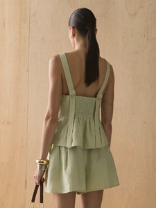 Pale green cotton summer two-piece set featuring backless smocked top and high waist shorts