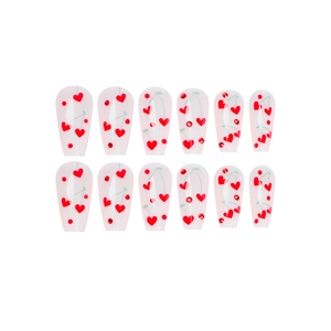 French style press-on nails with red heart cherry patterns and crystals on coffin shape