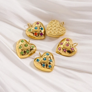 14K gold plated stainless steel heart pendants with colorful crystals on white silk fabric