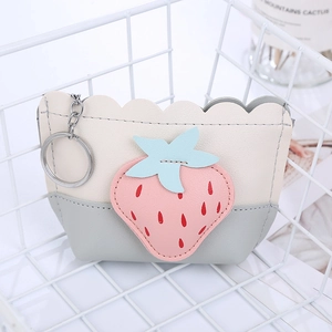 Cute strawberry coin purse with mixed colors and metal keychain in a white basket