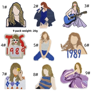 Close-up of nine Taylor Swift themed cartoon embroidery iron-on patches for kids' clothing