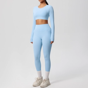 Full-body shot of light blue high-stretch seamless yoga set with long sleeve top and leggings