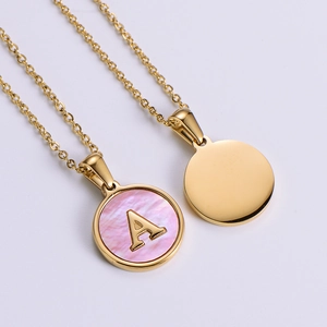 Gold stainless steel necklace with round pink shell pendant featuring initial letter A