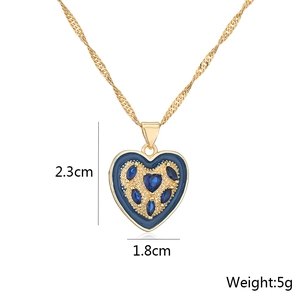 Detailed view of blue heart pendant with dimensions 2.3cm by 1.8cm weighing 5g
