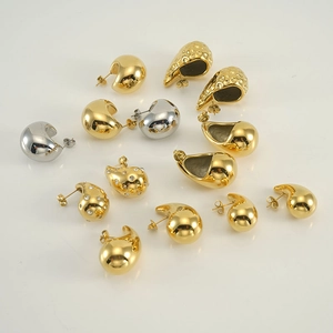 Modern 18K gold and silver chunky teardrop earrings with textured metal finish