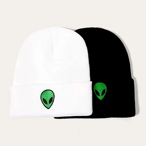 Two-pack knit beanie set in black and white featuring green alien head embroidery