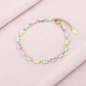 Detail of colorful enamel butterfly bracelet with gold chain and adjustable lobster clasp
