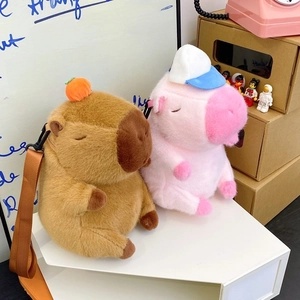 Detail of Capybara plush backpacks in brown and pink colors with adjustable straps