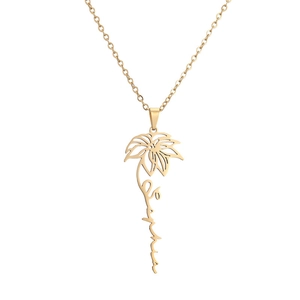 Macro view of gold stainless steel Sophia name necklace with intricate floral design