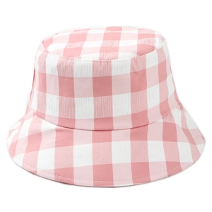 Detail view of pink and white checkered cotton bucket hat fabric texture and stitching