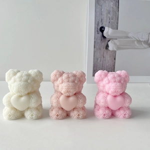 Three teddy bear candles with heart shapes in white and pink tones for DIY gift making