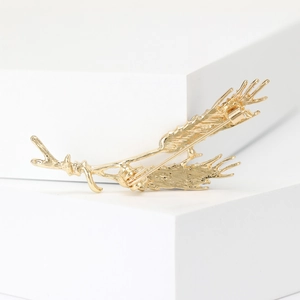 Elegant gold crystal wheat ear brooch for women's suits on white geometric background