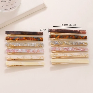 Set of 12 luxury acetate duckbill hair clips in diverse marble and leopard patterns