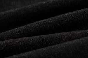 Macro di tessuto denim nero di alta qualità con eleganti dettagli plissettati